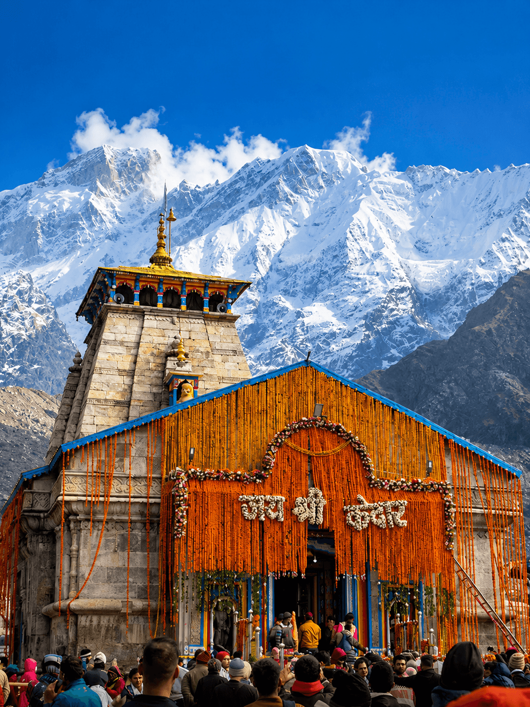 Kedarnath Temple's stone shrine framed by snow-capped Himalayan peaks in the Garhwal region